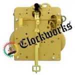 Rear-facing view of Hermle 141-041 clock movement showing strike control rod, rear hammer mechanism, and brass back plate.